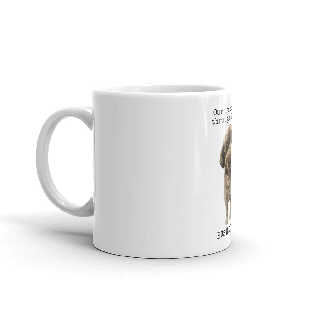 Our Traction is Through the Woof Mug